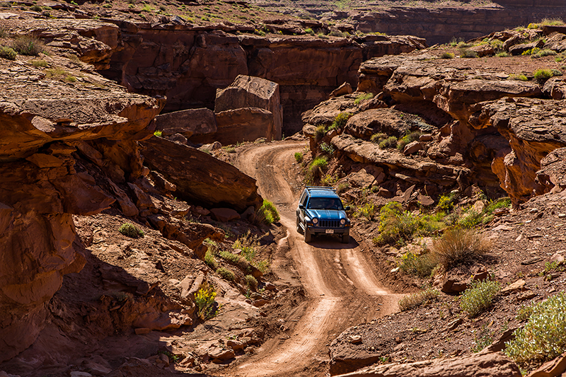 Traveling along the White Rim Trail in a Jeep Liberty - Photo by Randy Langstraat