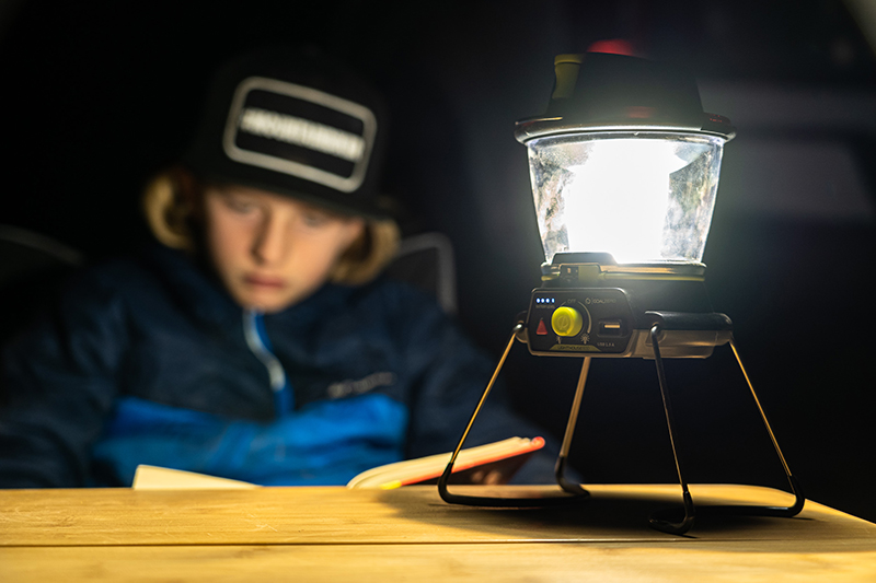 https://outdoorx4.com/wp-content/uploads/2020/12/Boy-Reading-by-Lantern-Light-at-Overland-Camp-in-Sedona-II.jpg